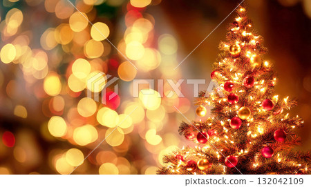 A Christmas tree with sparkling red and gold ornaments 132042109