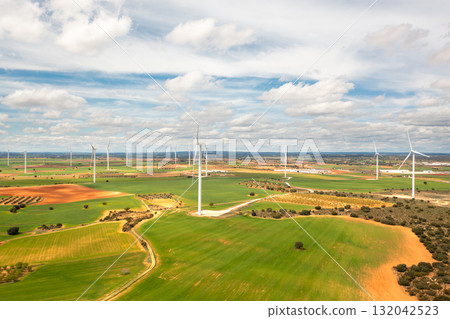 Aerial view of wind turbines in expansive green 132042523