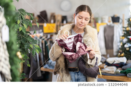 Young girl near showcase pick out and buying ladys bra, New Year eve Young girl near showcase pick out and buying ladys bra, New Year eve 132044046