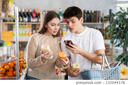Couple man and woman scanning qr code for sauces 132044176
