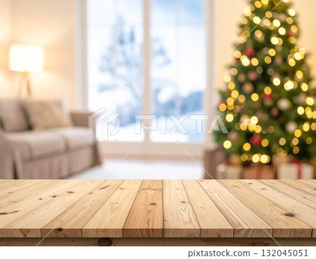 Empty room interior with a Christmas tree on a wooden floor near a blank wall Empty room interior with a Christmas tree on a wooden floor near a blank wall 132045051