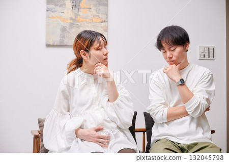 Worried couple, pregnant woman, consultation, maternity Worried couple, pregnant woman, consultation, maternity 132045798