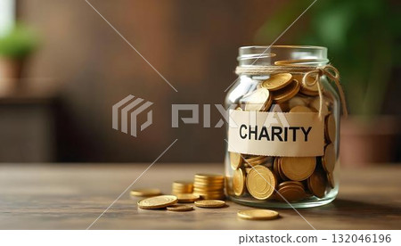 A charity jar with coins sits on a wooden table, illustrating the essence of volunteering and support for community initiatives A charity jar with coins sits on a wooden table, illustrating the essence of volunteering and support for community initiatives 132046196