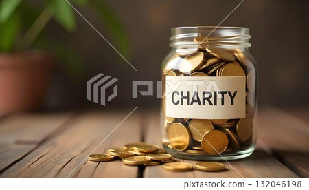 Coins in a charity jar on a wooden table, highlighting the importance of donations and community service on International Day of Charity Coins in a charity jar on a wooden table, highlighting the importance of donations and community service on International Day of Charity 132046198