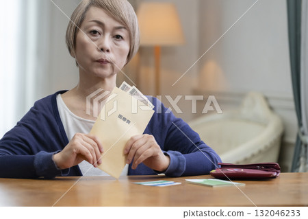 Senior women worried about medical expenses 132046233