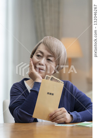 Smiling senior woman preparing medical expenses 132046267