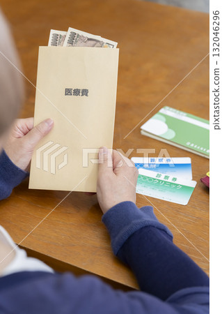 A woman preparing medical expenses A woman preparing medical expenses 132046296