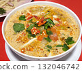 Bowl of Spicy and Savory Thai Tom Yum Goong Soup 132046742