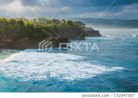 Tropical coastline with ocean and cloudy sky Tropical coastline with ocean and cloudy sky 132047087
