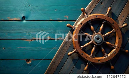 A ship's wheel made of wood sits on a wooden floor, representing nautical heritage and World Maritime Day 132047252