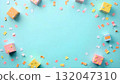 Colorful confetti boxes and scattered confetti on a vibrant blue background, celebrating International Children's Day 132047310