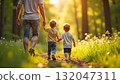 A man and child walk along a wooded path, reflecting the spirit of fun and unity on International Children's Day 132047311
