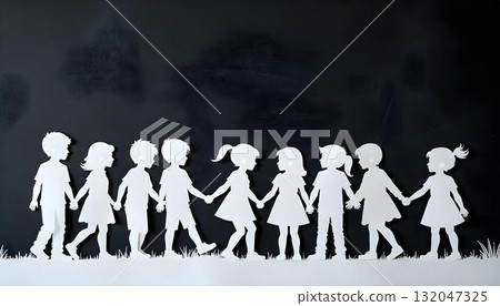 Paper cutout of children holding hands, symbolizing unity and joy for International Children's Day celebration 132047325