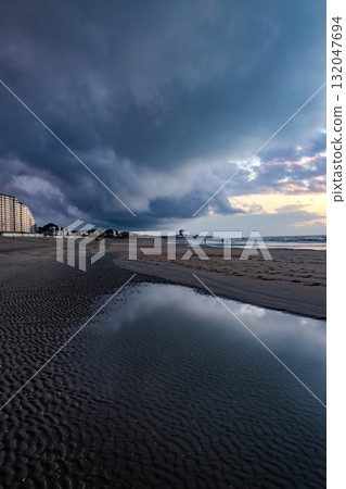 Nieuwpoort, West-Vlaanderen, Belgium, September 13th, 2025, Dramatic and Captivating Beach Scene 132047694