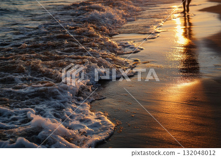 Joyful walk on a sunlit sandy beach at sunset 132048012