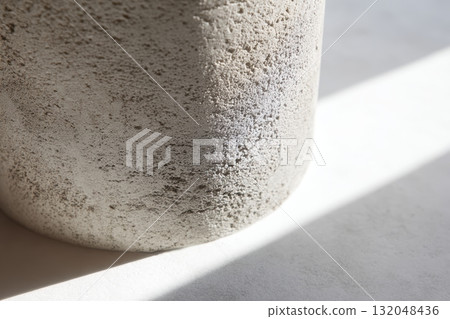 Natural light casting shadows on a textured surface 132048436
