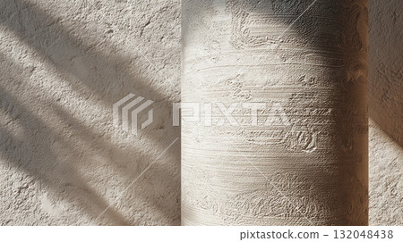 Light and shadow play on textured wall surface 132048438