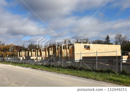 Wood frame house under construction site Wood frame house under construction site 132049251