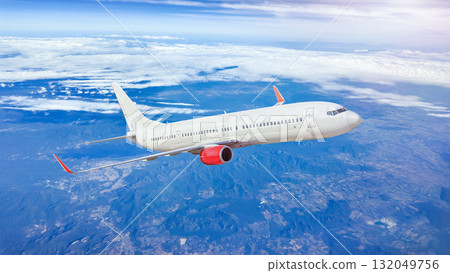 White passenger airplane flying in the sky 132049756