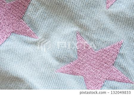 pink star patch on jeans texture background 132049833