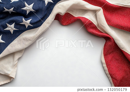 American Flag Draped with Texture and Detail on Light Background for Patriotic Themes 132050179