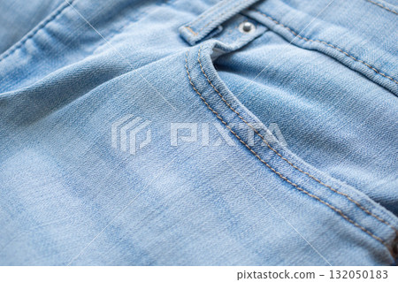 Old denim blue jeans fabric texture background close up Old denim blue jeans fabric texture background close up 132050183