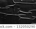 black crumpled and creased plastic poster texture background 132050290