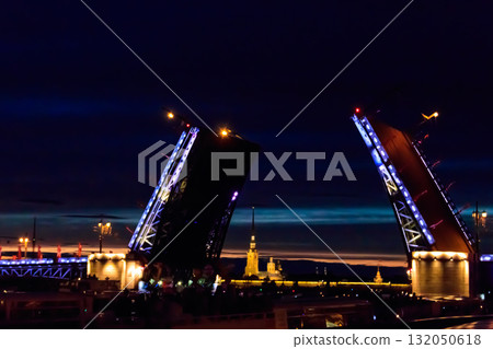 Opening of Palace drawbridge. Night view of Palace bridge from the Neva river in Saint Petersburg, Russia 132050618