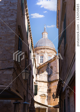 Dubrovnik cathedral dome rising above narrow old town street Dubrovnik cathedral dome rising above narrow old town street 132050685