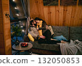 Cozy indoor moment between a couple in cabin setting during winter 132050853