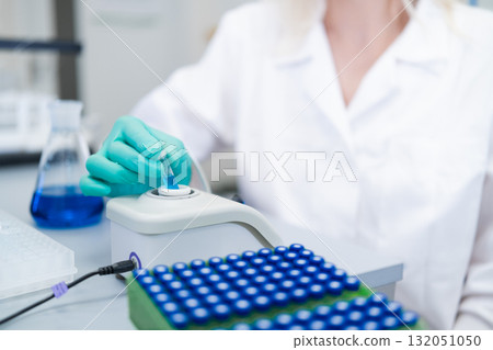 Analytical chemist preparing samples for HPLC analysis to identify and quantify compounds Analytical chemist preparing samples for HPLC analysis to identify and quantify compounds 132051050