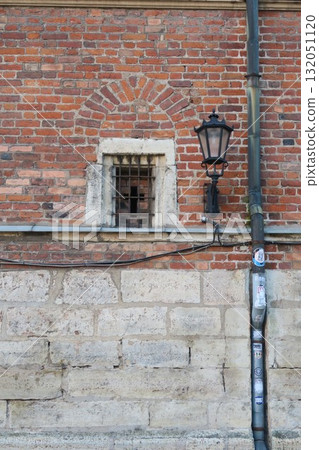 Cross-shaped hole in the outer wall of St. John's Church, Old Town Riga 132051120
