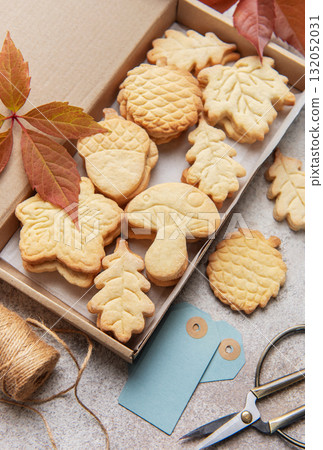 Autumn shaped cookies baking in cardboard gift box Autumn shaped cookies baking in cardboard gift box 132052031