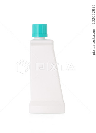 White plastic bottle with a turquoise cap, tilted and isolated on a clean white background. 132052955