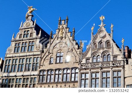Grote Markt guildhalls displaying renaissance architecture and golden statues under a clear blue sky in Antwerp, Belgium Grote Markt guildhalls displaying renaissance architecture and golden statues under a clear blue sky in Antwerp, Belgium 132053242