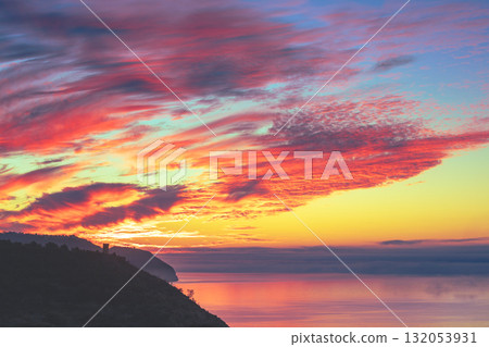 Seascape during a colorful sunrise. Beautiful sunrise over the mountains. Balcon De Maro, Maro, Malaga, Spain, Europe 132053931