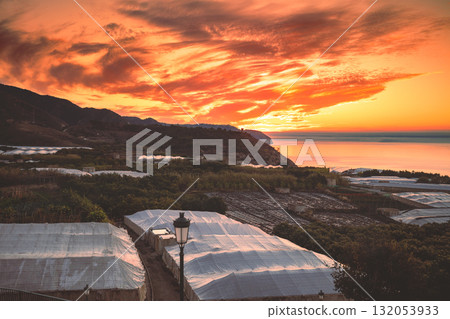 Seascape during a colorful sunrise. Beautiful sunrise over the mountains. Balcon De Maro, Maro, Malaga, Spain, Europe 132053933
