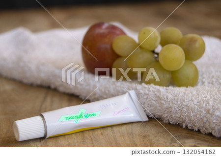 natural glow skincare cream with grapes and towel spa beauty concept natural glow skincare cream with grapes and towel spa beauty concept 132054162