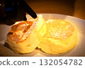 Fluffy pancakes drizzled with honey 132054782