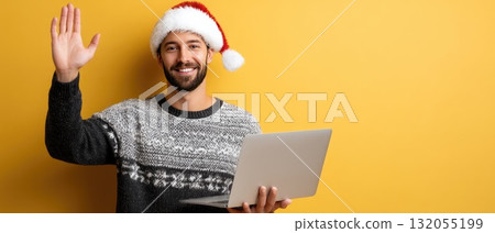 Cheerful young individual wearing a Christmas sweater and hat happily engages with a laptop in a vibrant setting celebrating the holidays 132055199