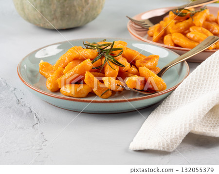Pumpkin recipe homemade gnocchi on pastel color background Pumpkin recipe homemade gnocchi on pastel color background 132055379