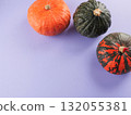 Three colorful pumpkins on purple background 132055381