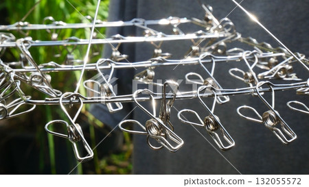 close up of Stainless Steel Clothes Hanger with Clips 132055572
