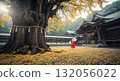 Autumn in Japan with a shrine maiden holding a fortune slip and a shrine surrounded by autumn leaves 132056022