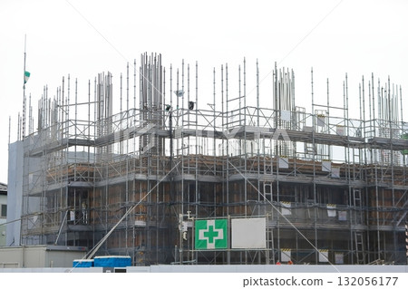 Apartment building construction site (external scaffolding) image during framework construction Apartment building construction site (external scaffolding) image during framework construction 132056177
