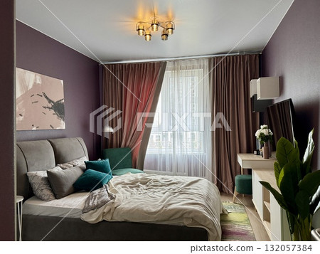 a modern bedroom in a stylish interior of a new apartment with designer renovation a modern bedroom in a stylish interior of a new apartment with designer renovation 132057384
