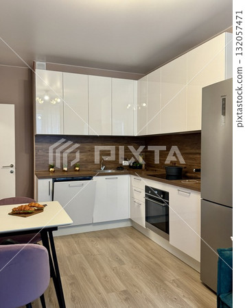new stylish kitchen set in a modern apartment interior 132057471