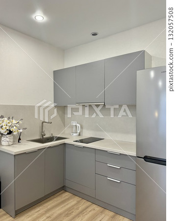new stylish kitchen set in a modern apartment interior 132057508