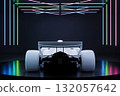 rear view of a white formula one car in a studio with bright neon lighting 132057642