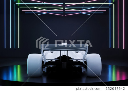 rear view of a white formula one car in a studio with bright neon lighting 132057642